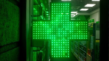 Green cross on the pharmacy door