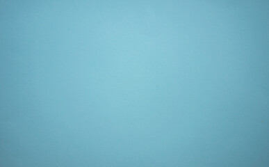 A blank blue sheet of paper. Space for text on a blue background. The color of the sea wave.The shade of the sea breeze