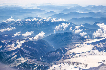 mountains and clouds from plane window