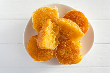 Portuguese sweet bean cake called Pastel de Feijao on white wooden table