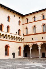 Fototapeta na wymiar Square in front of the inner walls of Castello Sforzesco. Milan, Italy
