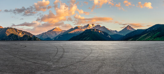 Empty asphalt road and mountain natural scenery at sunrise