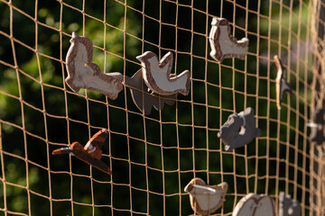 clay birds on a grid handmade