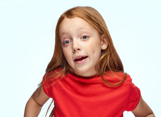 girl with red hair posing red t-shirt childhood