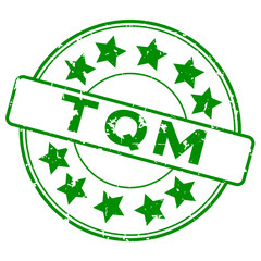 Grunge green TQM (Abbreviation of total quality management) word with star icon round rubber seal stamp on white background