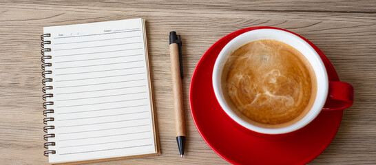 blank notebook and coffee cup on wood table. Motivation, Resolution, To do list, Strategy and Plan concept