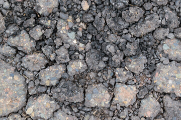Crushed asphalt. Stones and pieces of asphalt for backdrop.