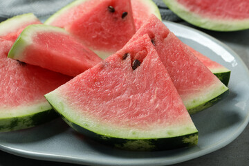 Delicious fresh watermelon slices on plate, closeup