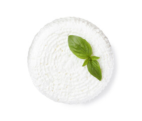 Fresh cottage cheese with basil isolated on white, top view