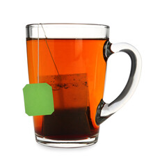 Tea bag in glass cup of hot water isolated on white