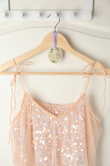 Scented sachet with flowers and stylish clothes on hanger