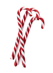Delicious Christmas candy canes on white background, top view