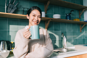 Portrait of young Asian woman relaxing at home