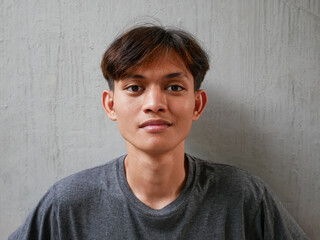 portrait of young asian man, face close-up
