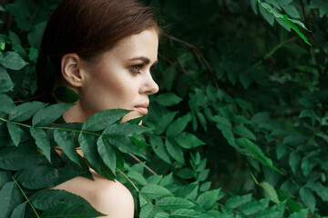 attractive woman Cosmetology nature green leaves glamor close-up