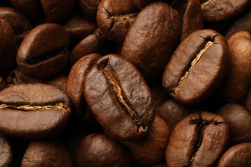 Pile of roasted coffee beans as background, closeup