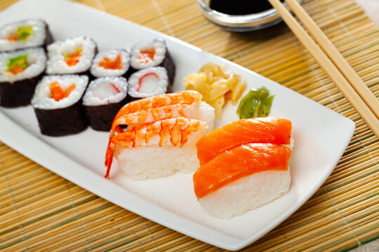 Various of nigiri and hosomaki sushi traditionally served with wasabi and soy sauce. High quality photo