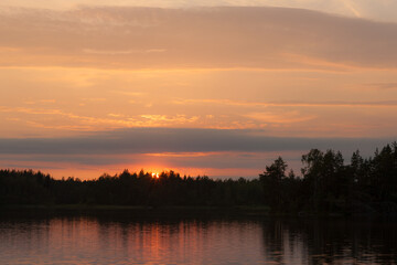 Fototapeta na wymiar sunset with clouds in summer