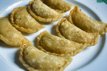Beef Empanadas. Traditional food. Empanadas are crescent-shaped, savory pastries made of dough and filled with a variety of ingredients.
