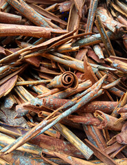 Cinnamomum cassia. Heap of dried and crushed cinnamon sticks, with left-over outer bark, or unfinished shaving.