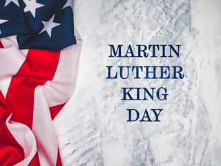 Happy Martin Luther King day. Congratulatory inscription on the background of the American Flag. No...