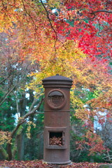 Hyogo,Japan- November 23, 2021: An obsolete rusty mailbox in autumn  
