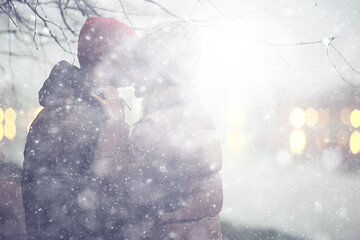 couple in love winter evening hugging outside, seasonal abstract background, weather twilight rain