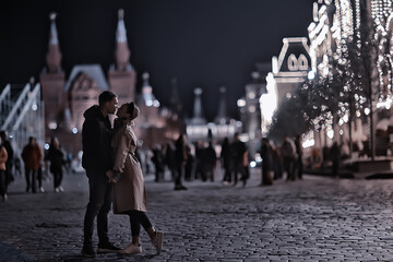 couple in love in moscow night winter, young family evening in winter moscow, autumn style
