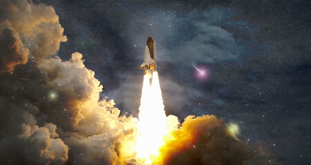 Space shuttle taking , Spaceship lift off with blast and smoke on the background of the blue planet earth and sunset.Elements of this image furnished by NASA