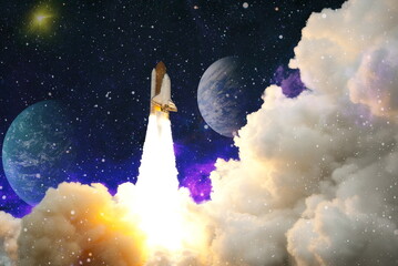 Rockets launch into space on the starry sky. spacecraft flies into space with clouds of smoke. Elements of this image furnished by NASA