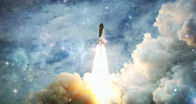 Spaceship takes off into the starry sky. Rocket starts into space. Concept , Elements of this image furnished by NASA - Powered by Adobe
