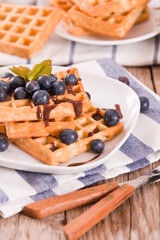 Waffles with blueberries and chocolate cream. 