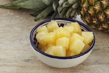 Marinated pineapple slices in the bowl