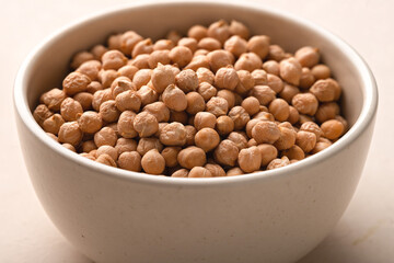 Bowl raw uncooked chickpeas close-up
