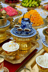 assortment of offering during ceremony in buddhist temple