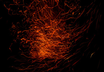 Sparks from fire on a black