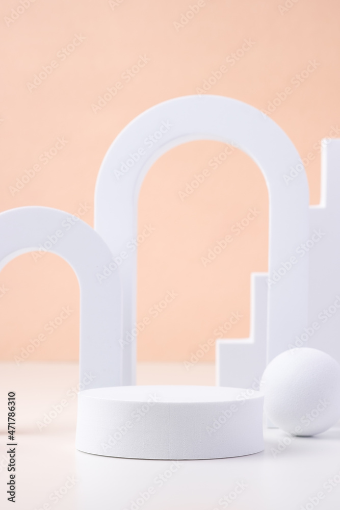 Aufkleber geometric pedestal block on white table and pastel peach background.mockup for display product
