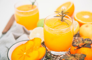 persimmon juice in a glass And there are orange slices. healthy drink concept