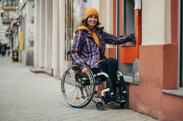 Woman with disability using credit card and atm machine