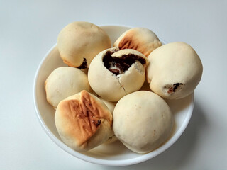 Nopia, is a traditional snack from Banyumas, Indonesia. Made from flour dough filled with red sugar, baked in a furnace. Isolated on white background.