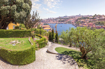 View of the Douro River and walking alleys of park from the Cristal Palace Gardens or Jardins do Palaio de Cristal. Porto, Portugal.