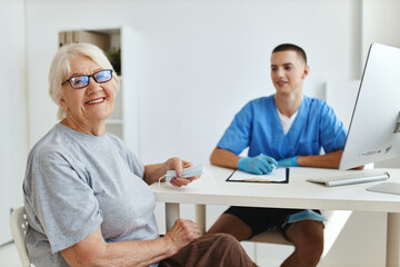 Fototapeta premium elderly woman patient sitting in the doctor's office health care
