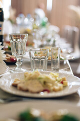 beautifully set table at a wedding banquet with delicious food and alcohol