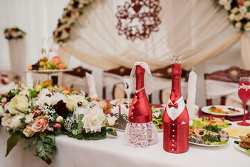 beautifully set table at a wedding banquet with delicious food and alcohol