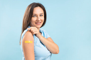 Smiling young woman after vaccination against coronavirus - obrazy, fototapety, plakaty