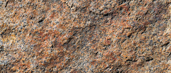 Cracked granite stone texture. Granite rock surface. Natural stone backdrop