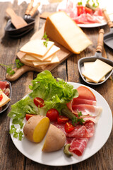 raclette cheese with potato and salami