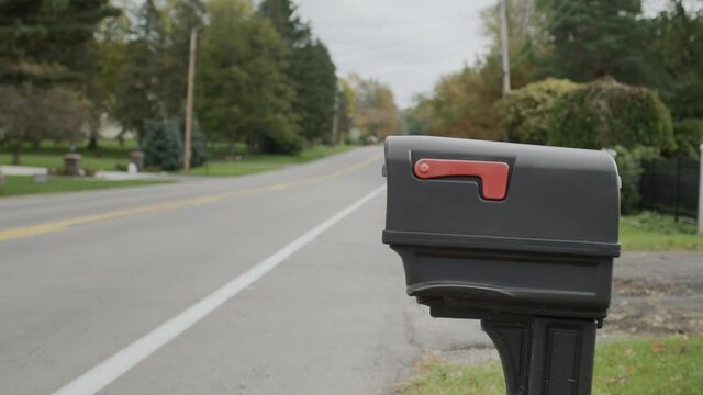 A mailbox by the road. Typical for the suburbs of the UNITED STATES