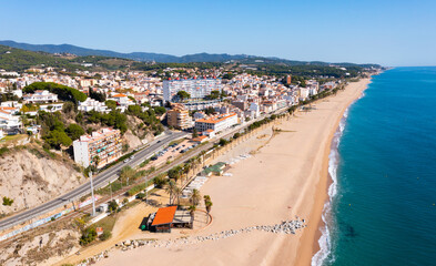 Aerial photo of Spanish municipality Canet de Mar with view of beach and residential buildings.
