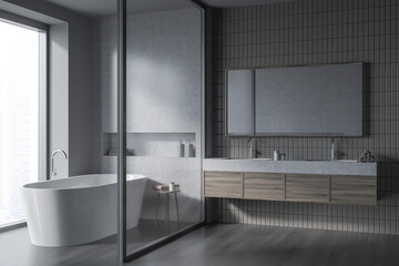 Bathroom interior with two sinks and mirror, bathtub behind partition, window